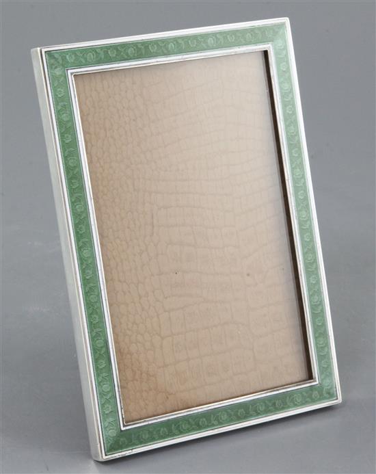 An early 20th century continental silver and two colour enamel mounted rectangular photograph frame, 18cm.